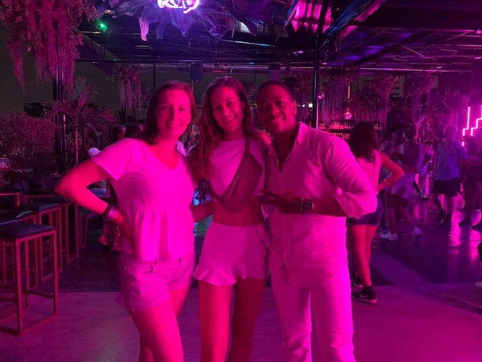 Giselle and her friends dressed in white clothes at a white themed night in La Pergola