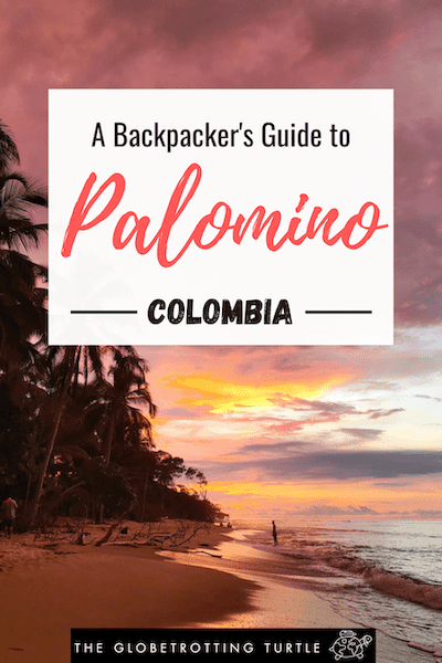 A Pinterest Pin of a pink and orange sunset seen from Palomino beach. A text overlay reads 'A Backpacker's guide to Palomino, Colombia.